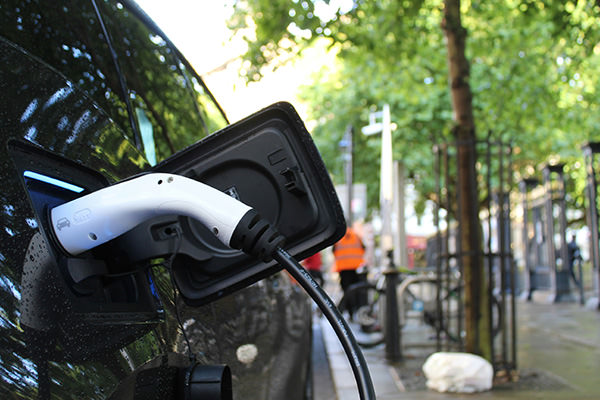 Residential street charging. Photo by Andrew Roberts on Unsplash.